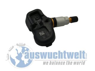 Das Bild zeigt einen Reifendrucksensor mit Ventil, der schräg von oben fotografiert wurde. Im Hintergrund unten ist ein teilweise sichtbares Logo mit einer stilisierten Weltkugel und dem Schriftzug „auswuchtwelt we balance the world“ zu sehen.